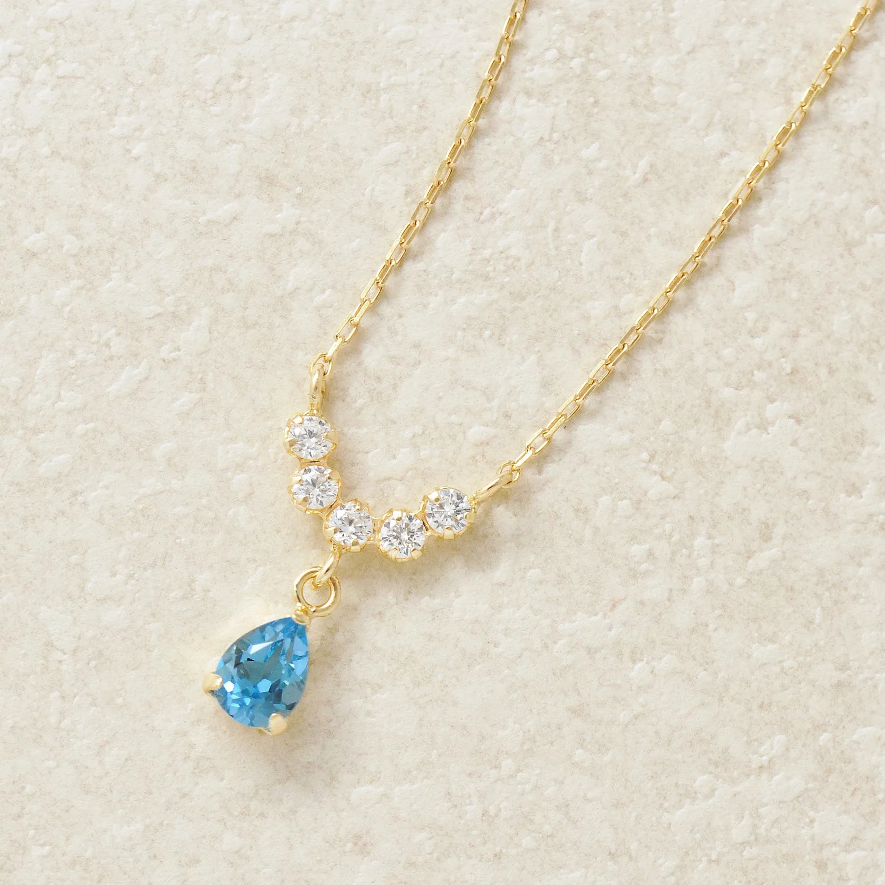 10K Yellow Gold Birthstone (Swiss Blue Topaz) Swinging Necklace