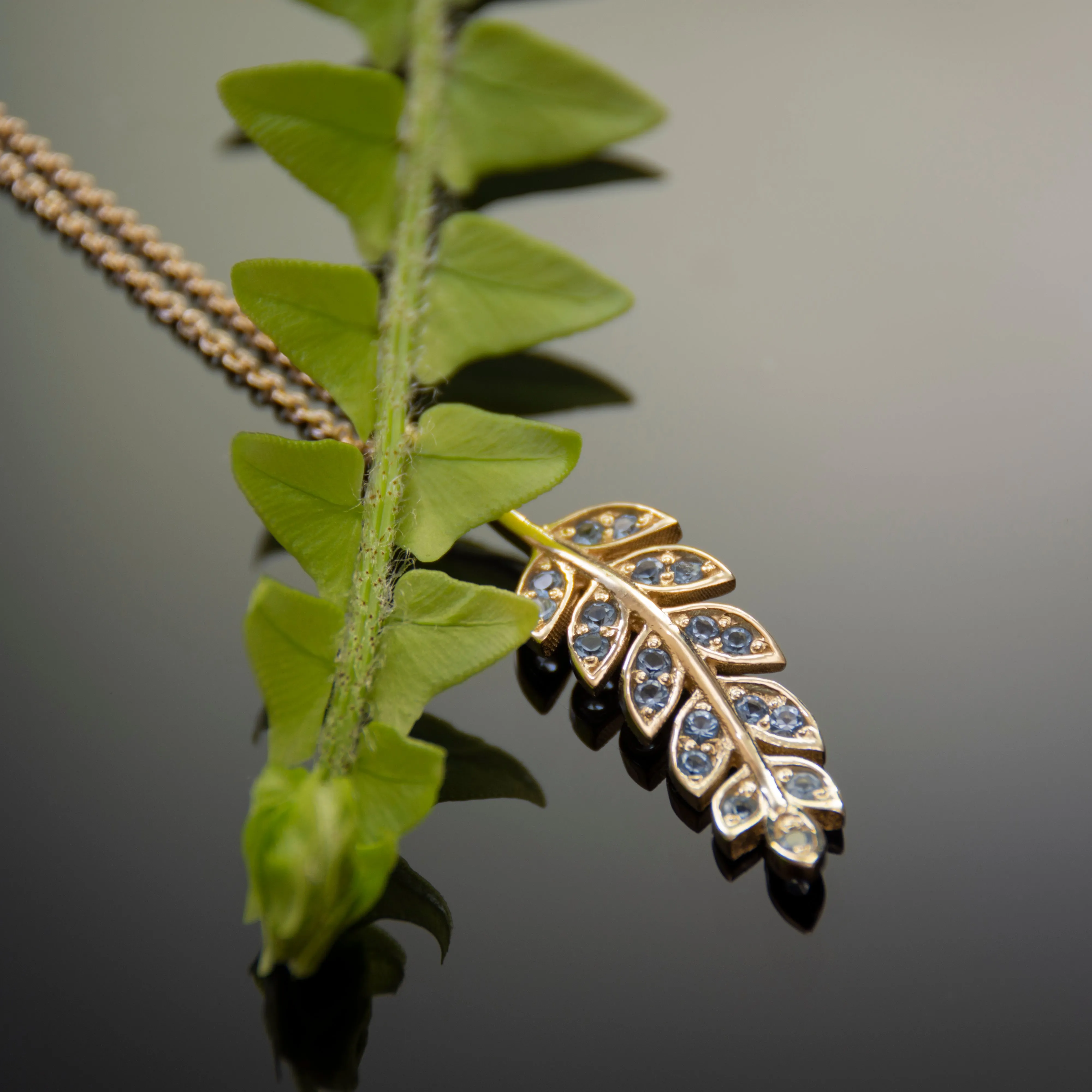 NG4754A Gold Y Necklace with Leaf Pendant and Topaz
